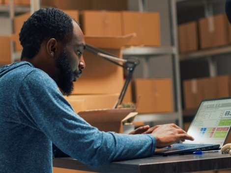 male-entrepreneur-analyzing-stock-products-orders-doing-inventory-laptop-warehouse-young-man-using-logistics-financial-planning-send-merchandise-development-handheld-shot_482257-62665